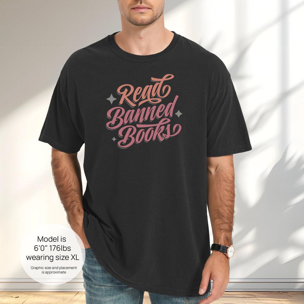 Male model wearing black t-shirt with stylized text reading “Read Banned Books” in bold script lettering. Includes size and fit information for the model who is 6 feet 0 inches, 176 pounds, and wearing a size XL shirt.
