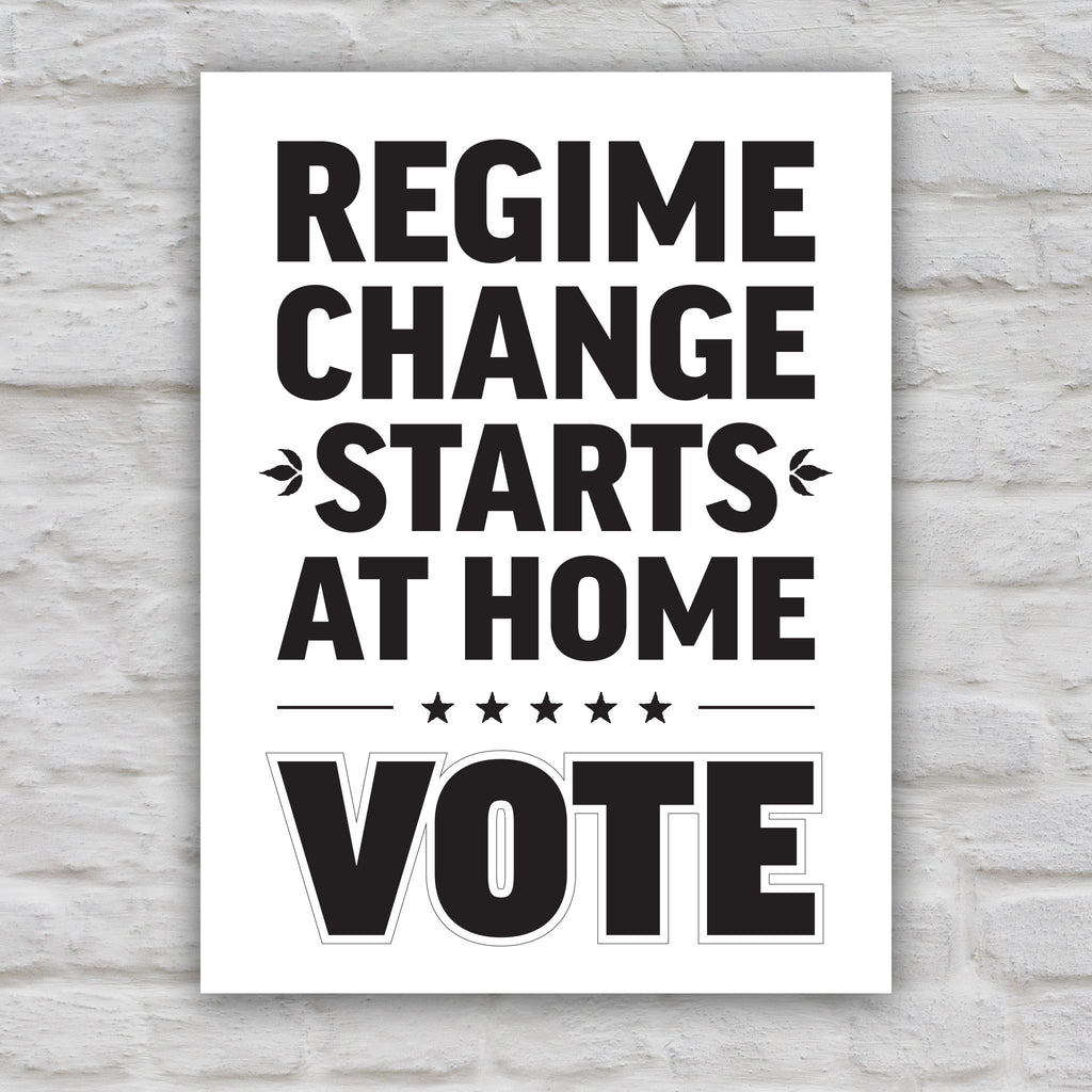 Black and white version of protest sign reading “Regime Change Starts at Home — Vote” in red and blue political typography.