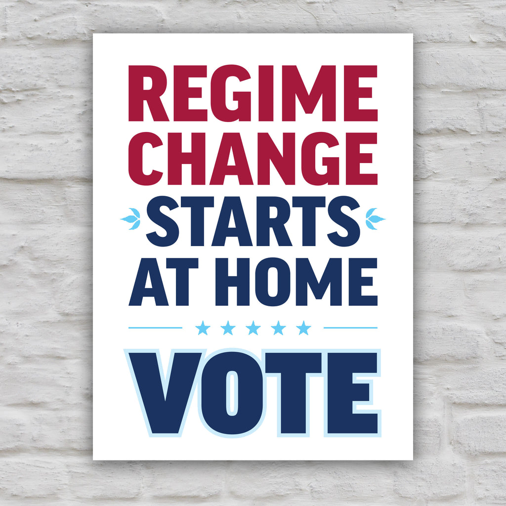Color version of protest sign reading “Regime Change Starts at Home — Vote” in red and blue political typography.