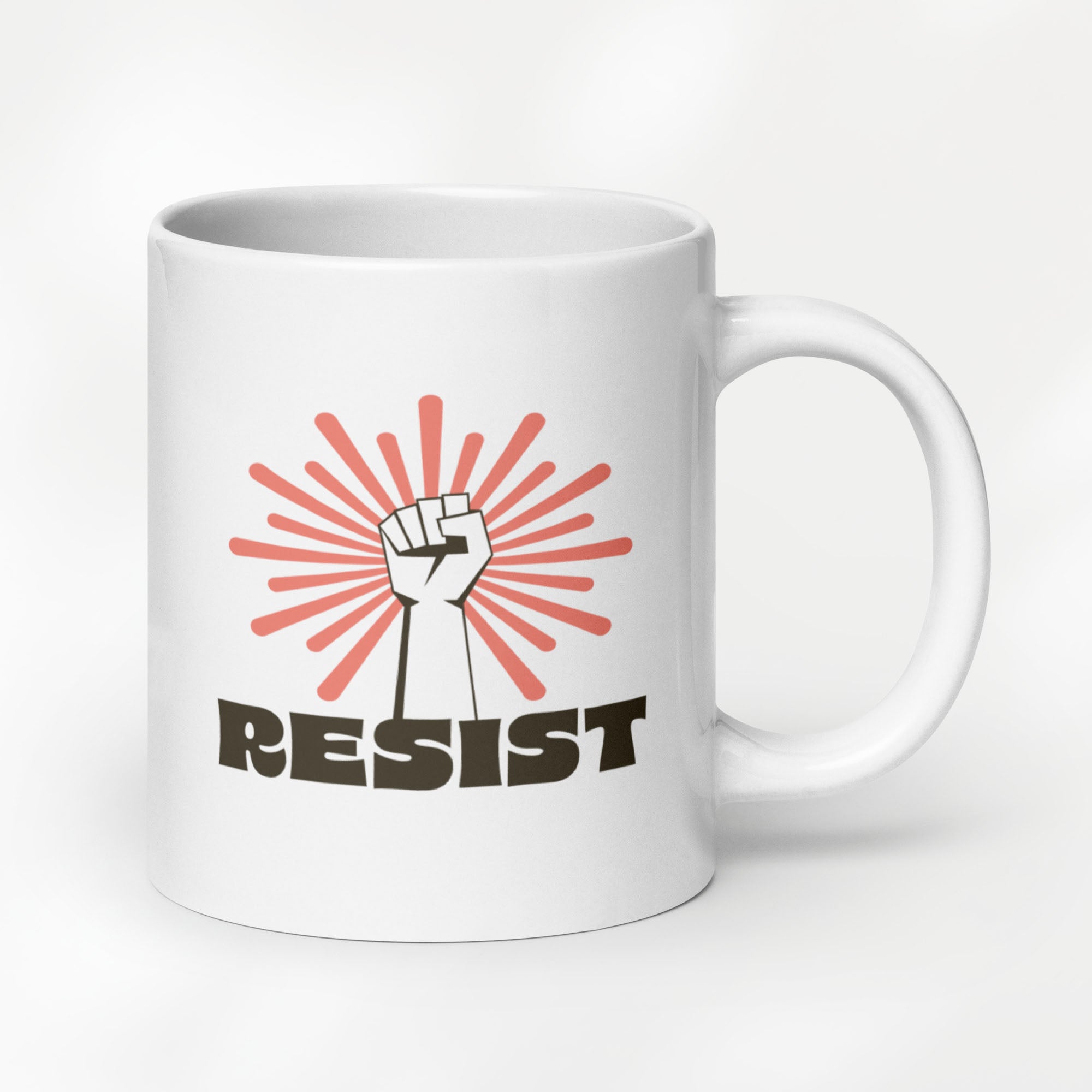 20 ounce ceramic mug with a raised fist graphic in front of a coral burst, and bold retro-styled text that says "resist."