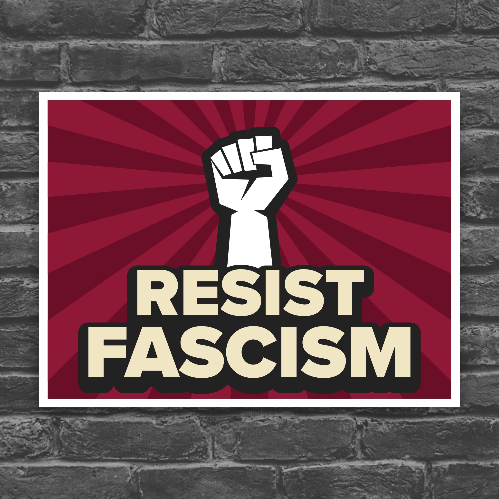 Color version of protest sign with red burst background and white raised fist above text that reads "Resist fascism" in all uppercase letters.