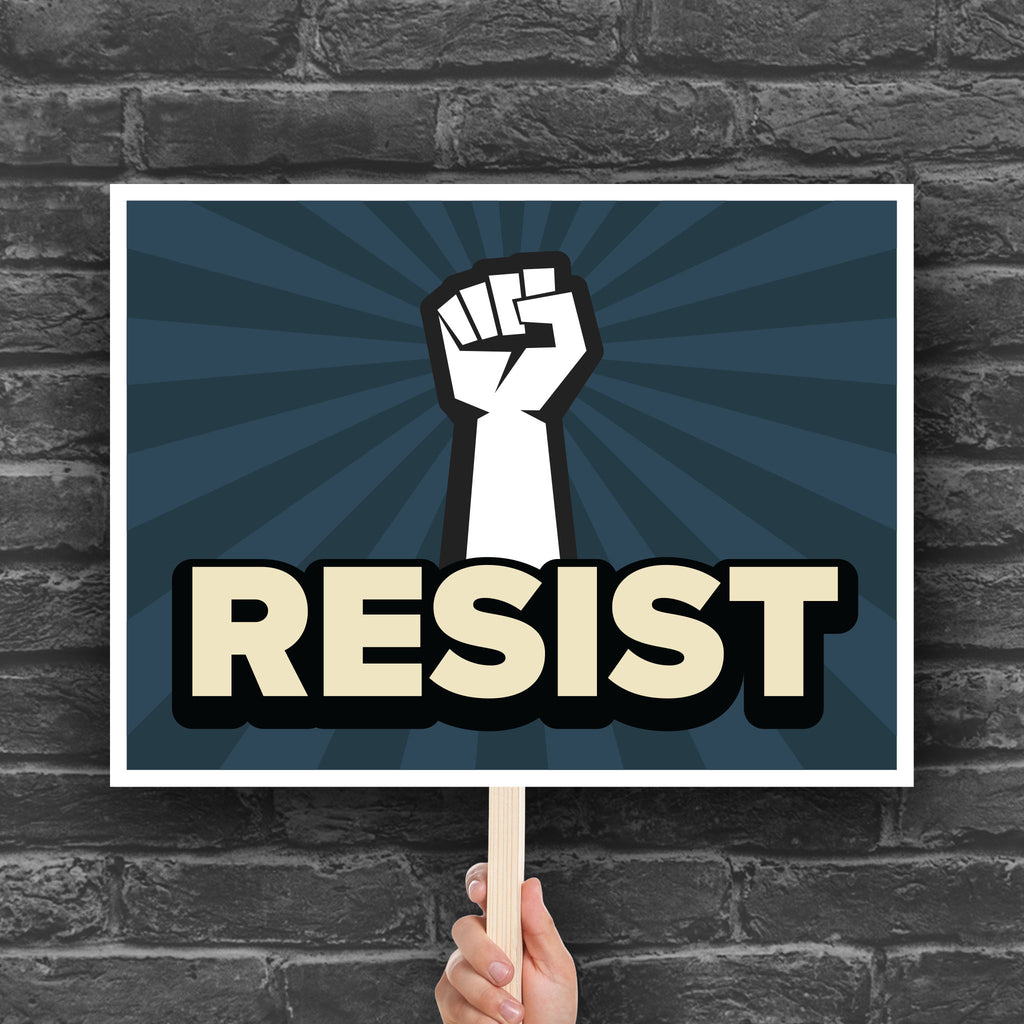 Anti-trump resistance protest sign with a raised fist and the word "Resist" below it.