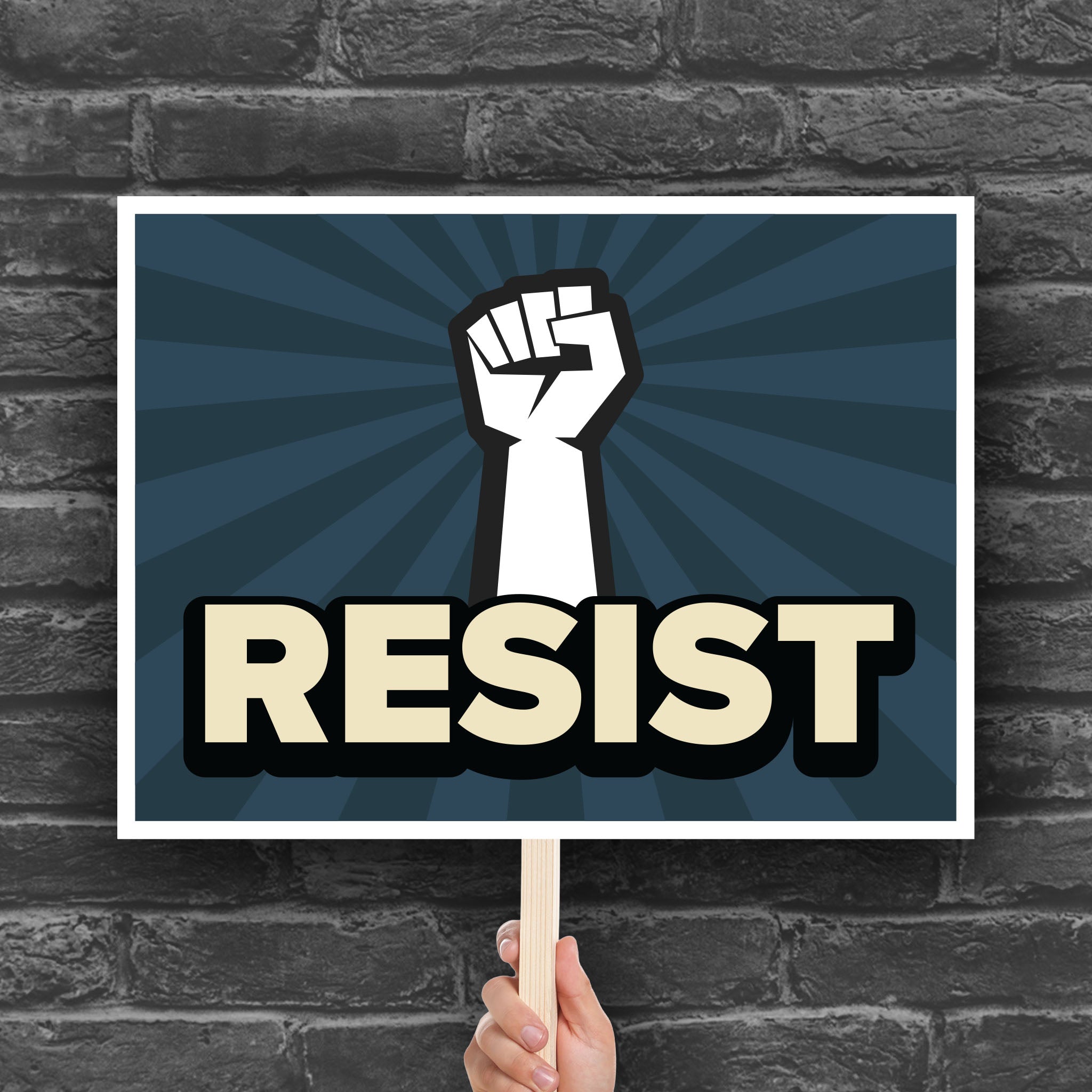 Anti-trump resistance protest sign with a raised fist and the word "Resist" below it.