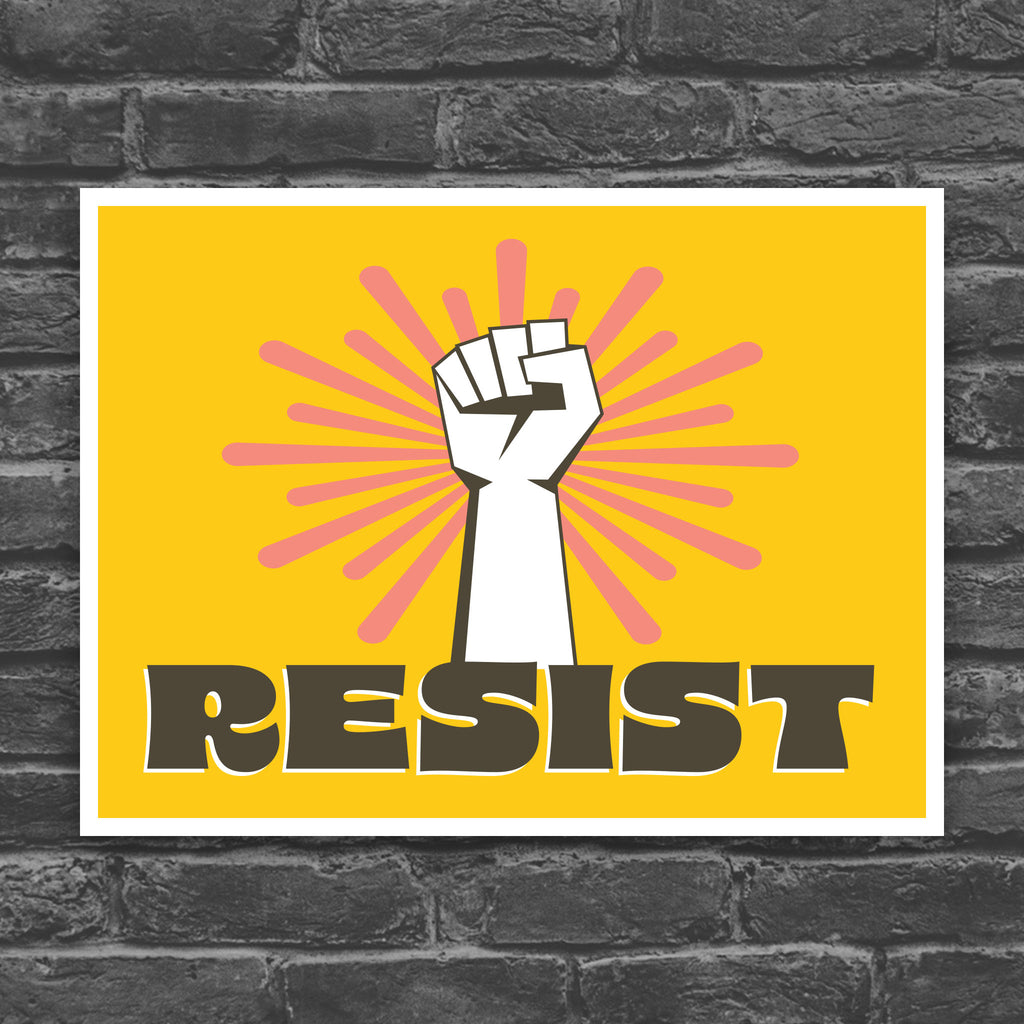Printable protest sign with a white raised fist and the word “resist” in bold brown letters on a bright yellow background with pink radiating lines.