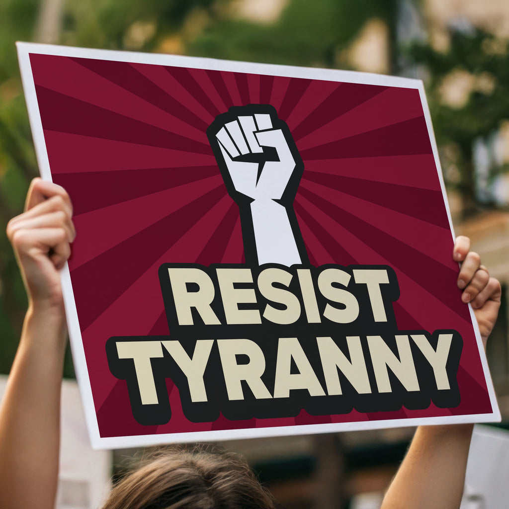 Red color version of downloadable, printable anti-Trump protest sign with bold text that reads "resist tyranny" below a raised fist, held high above a crowd.