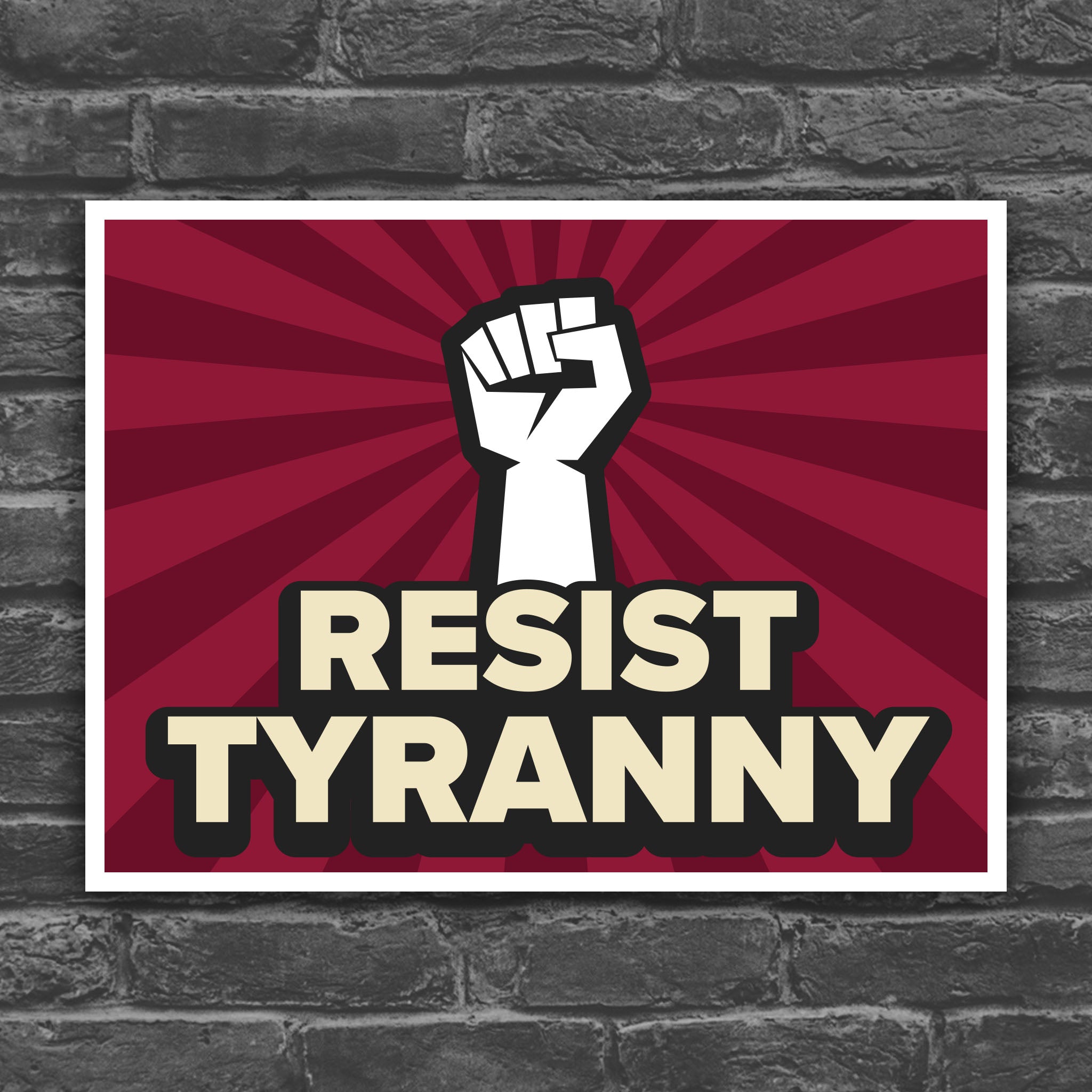 Color version of protest sign with bold text that reads "resist tyranny" below a raised fist.