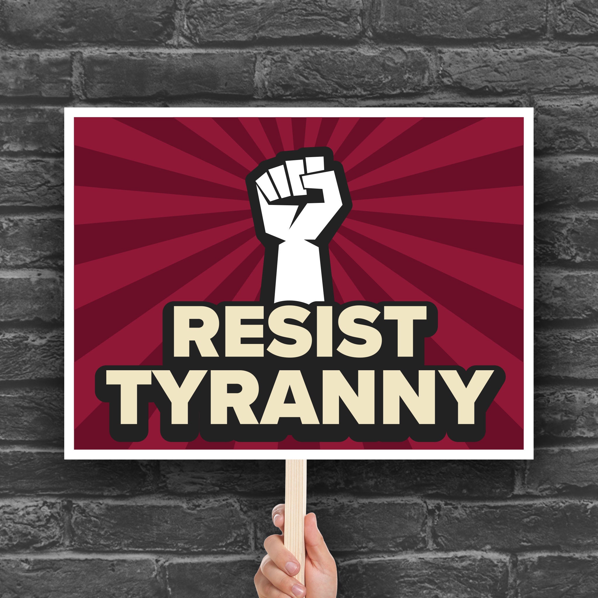 Red color version of downloadable, printable anti-Trump protest sign with bold text that reads "resist tyranny" below a raised fist.