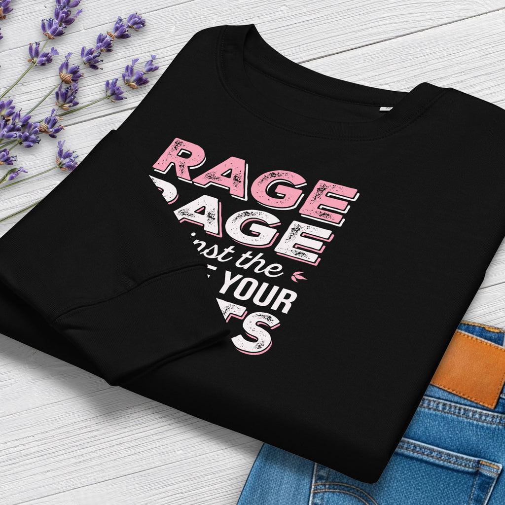 Folded black protest sweatshirt with bold pink and grey text reading “rage rage against the dying of your rights” – feminist anti-trump activist shirt.