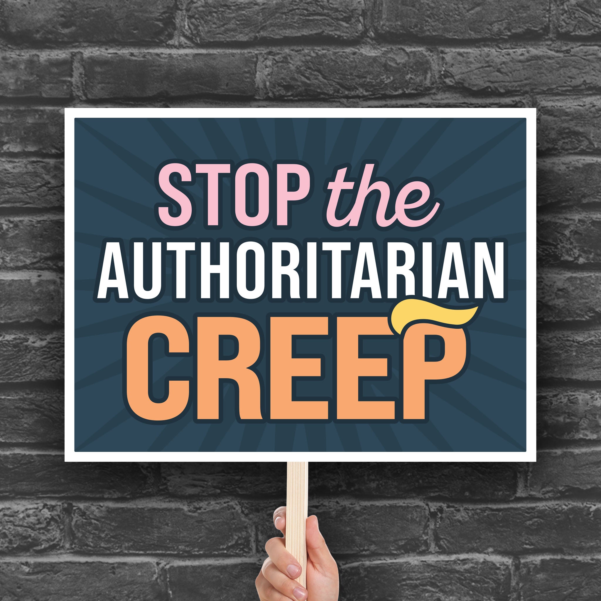 Downloadable, printable protest sign with the phrase "Stop the Authoritarian Creep" in bold lettering, featuring a yellow hairpiece resembling Trump’s weird hair on the last letter of the word “Creep,” emphasizing the double meaning of the sign.