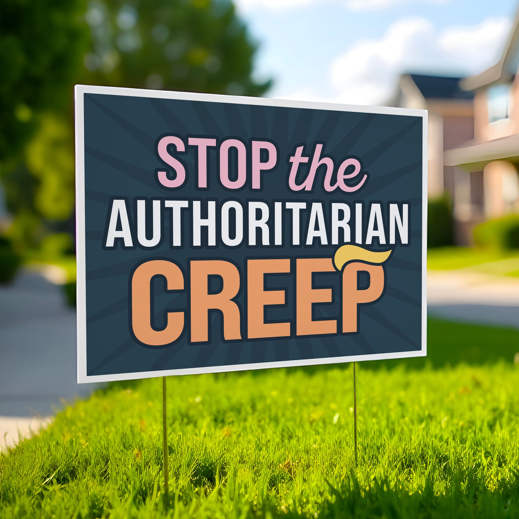 Yarad sign in a green lawn with the phrase "Stop the Authoritarian Creep" in bold lettering, featuring a yellow hairpiece resembling Trump’s weird hair on the last letter of the word “Creep,” emphasizing the double meaning of the sign.