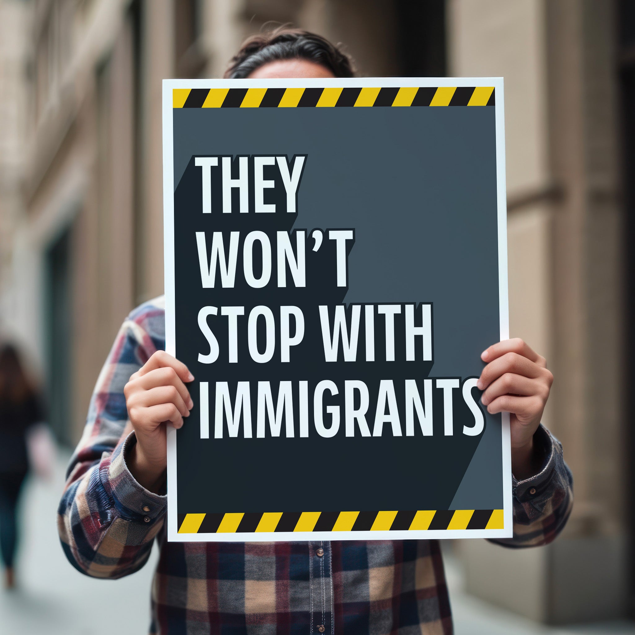 Person holding anti-ICE, anti-Trump protest sign with bold white text reading "they won't stop with immigrants" on a grey background with yellow warning stripes at the top and bottom.