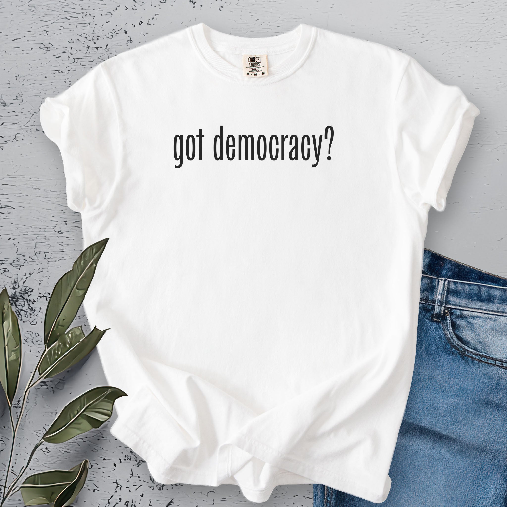 White t-shirt with black text reading “got democracy?” in minimalist font, styled like the classic “got milk?” campaign design.