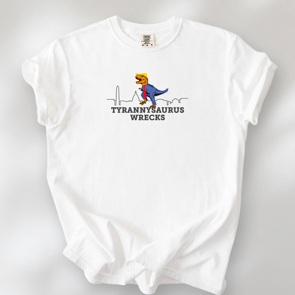 White t-shirt with a funny drawing of an orange t-rex dinosaur. Includes size and fit information for the model who is 6 feet 0 inches, 176 pounds, and wearing a size XL shirt. T-Rex is dressed in a blue suit with a red tie that's too long, stupid yellow hair, and tiny hands. The dinosaur is stepping on a line drawing of the Washington DC skyline. Under the dinosaur is bold text that reads "tyranny saurus wrecks."
