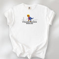 White t-shirt with a funny drawing of an orange t-rex dinosaur. Includes size and fit information for the model who is 6 feet 0 inches, 176 pounds, and wearing a size XL shirt. T-Rex is dressed in a blue suit with a red tie that's too long, stupid yellow hair, and tiny hands. The dinosaur is stepping on a line drawing of the Washington DC skyline. Under the dinosaur is bold text that reads "tyranny saurus wrecks."