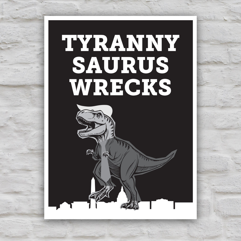Black and white version of funny anti-trump protest sign featuring a line drawing of a t-rex tyrannosaurus rex dinosaur in greyscale resembling Donald Trump, with the caption “TYRANNY SAURUS WRECKS” in bold white letters above. The dinosaur is stepping on a silhouette of the Washington D.C. skyline.
