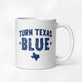 11 ounce white ceramic coffee mug featuring a distressed blue "Turn Texas Blue" design with a Texas state silhouette.