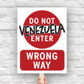 Anti-Trump protest sign that looks like a "do not enter" street sign that reads "do not enter Venezuela; wrong way."