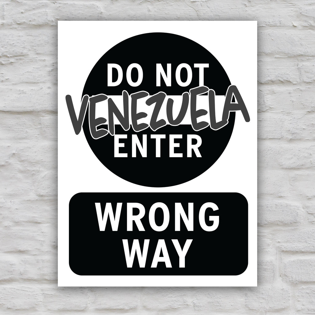 Black and white version of anti-Trump protest sign that looks like a "do not enter" street sign that reads "do not enter Venezuela; wrong way."
