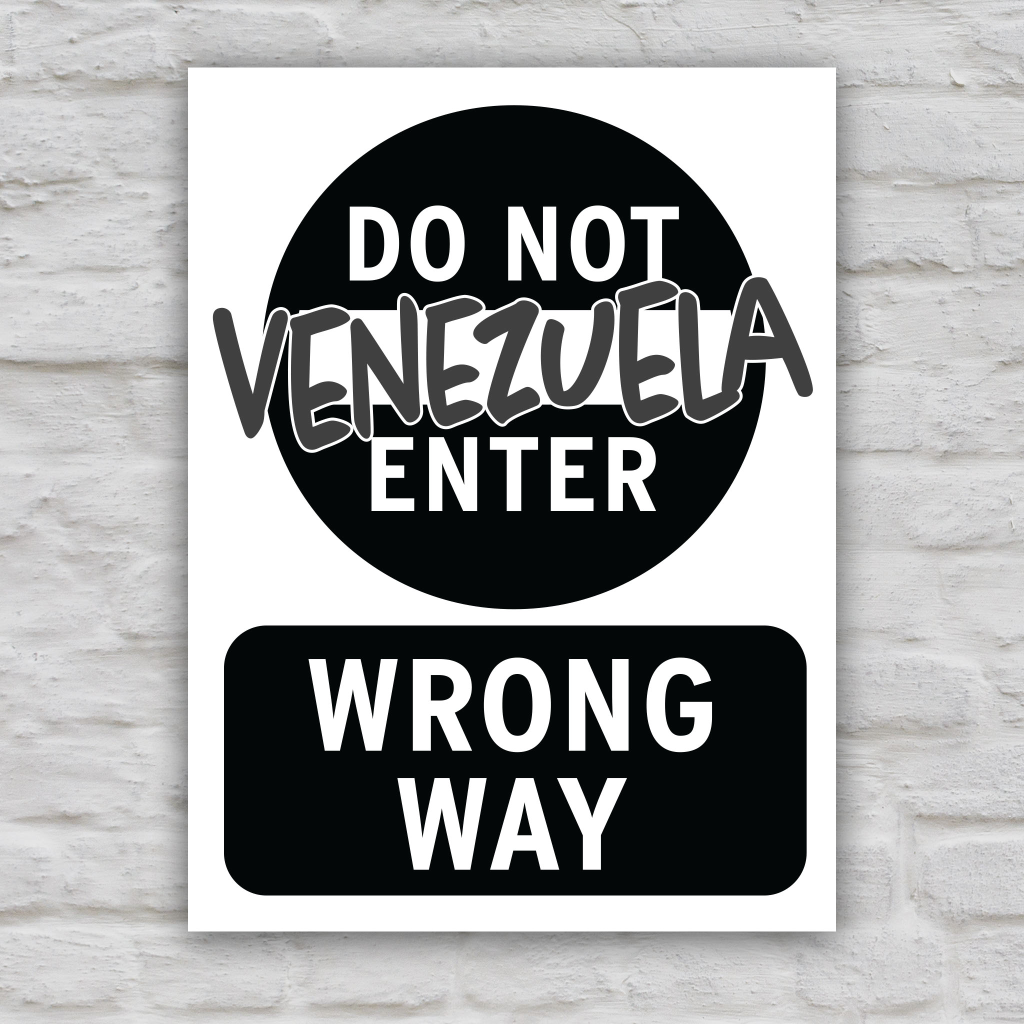 Black and white version of anti-Trump protest sign that looks like a "do not enter" street sign that reads "do not enter Venezuela; wrong way."