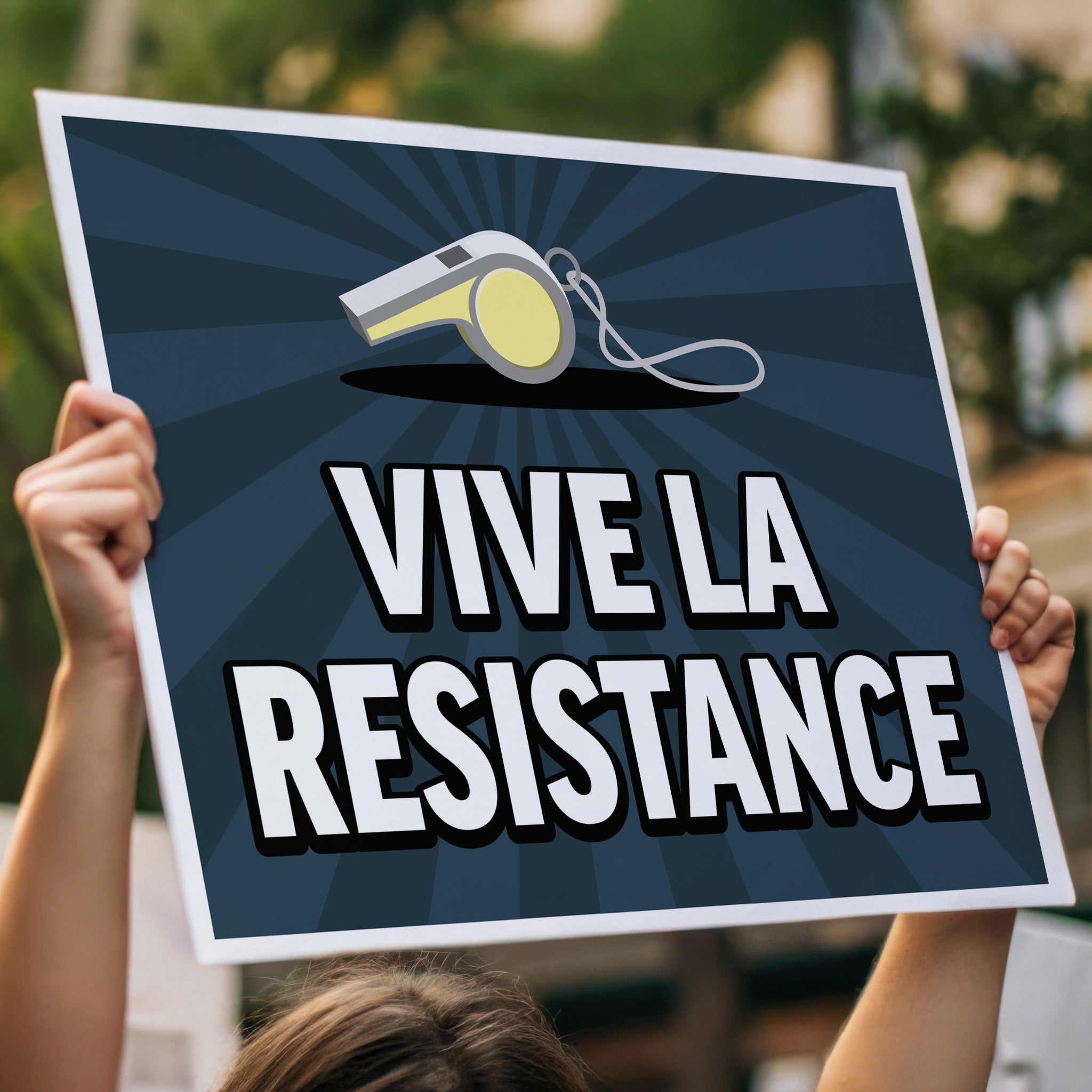 Person holding, high above their head, a protest sign that has an illustration of a whistle, with text that reads "vive la resistance" below it with a blue background with burst emphasis.