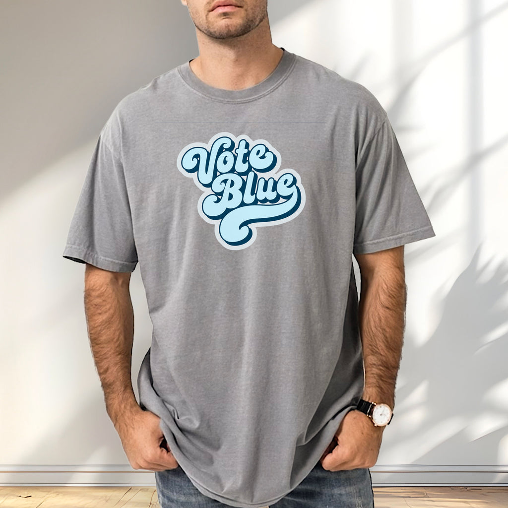 Male model wearing grey t-shirt featuring a retro blue "Vote Blue" script graphic.