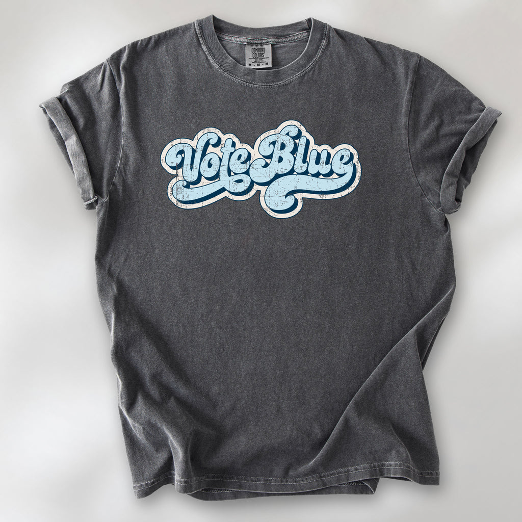 Pepper t-shirt featuring distressed retro script text reading "Vote Blue" in light blue vintage lettering.