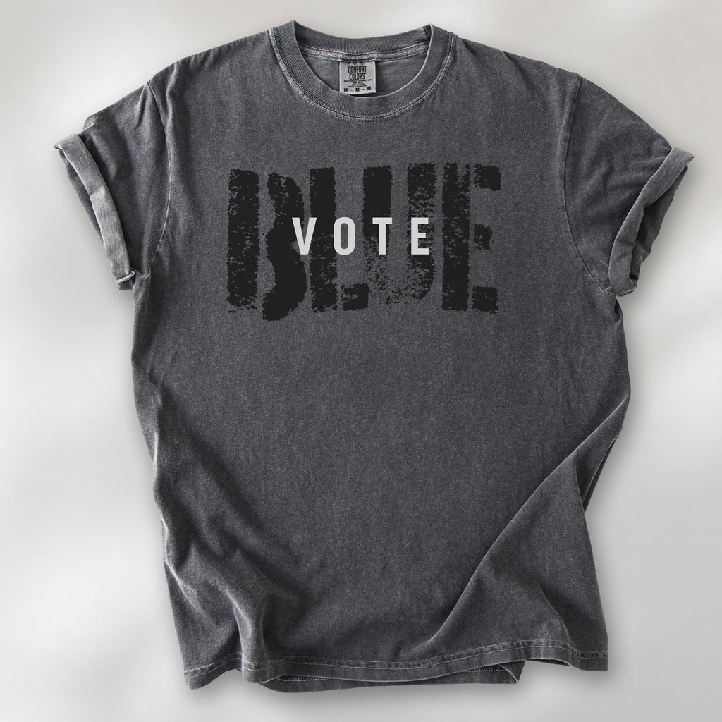 Pepper t-shirt with the word "vote" atop the word "blue" in a grunge background texture.
