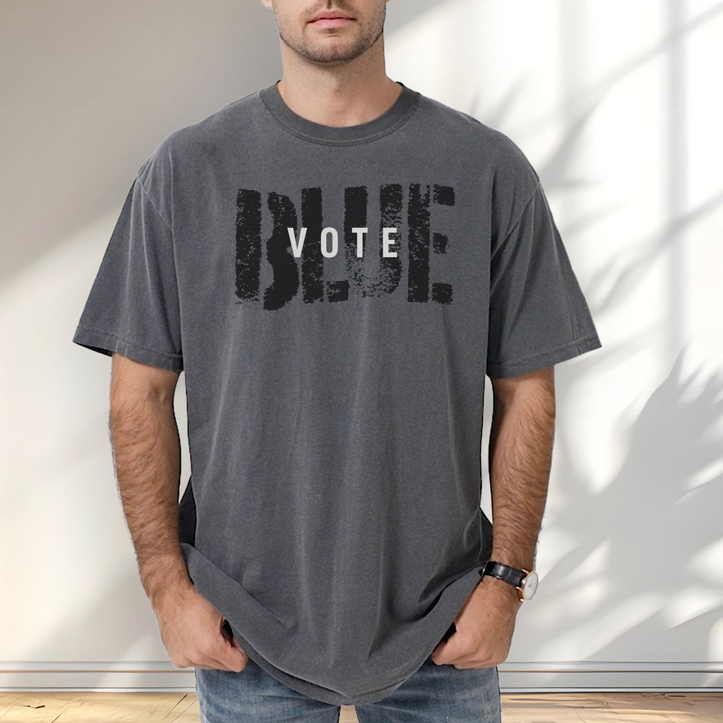 Male model wearing pepper t-shirt with the word "vote" atop the word "blue" in a grunge background texture.
