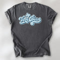 Pepper t-shirt featuring distressed retro "Vote Blue" script lettering with the outline of Texas above the design.