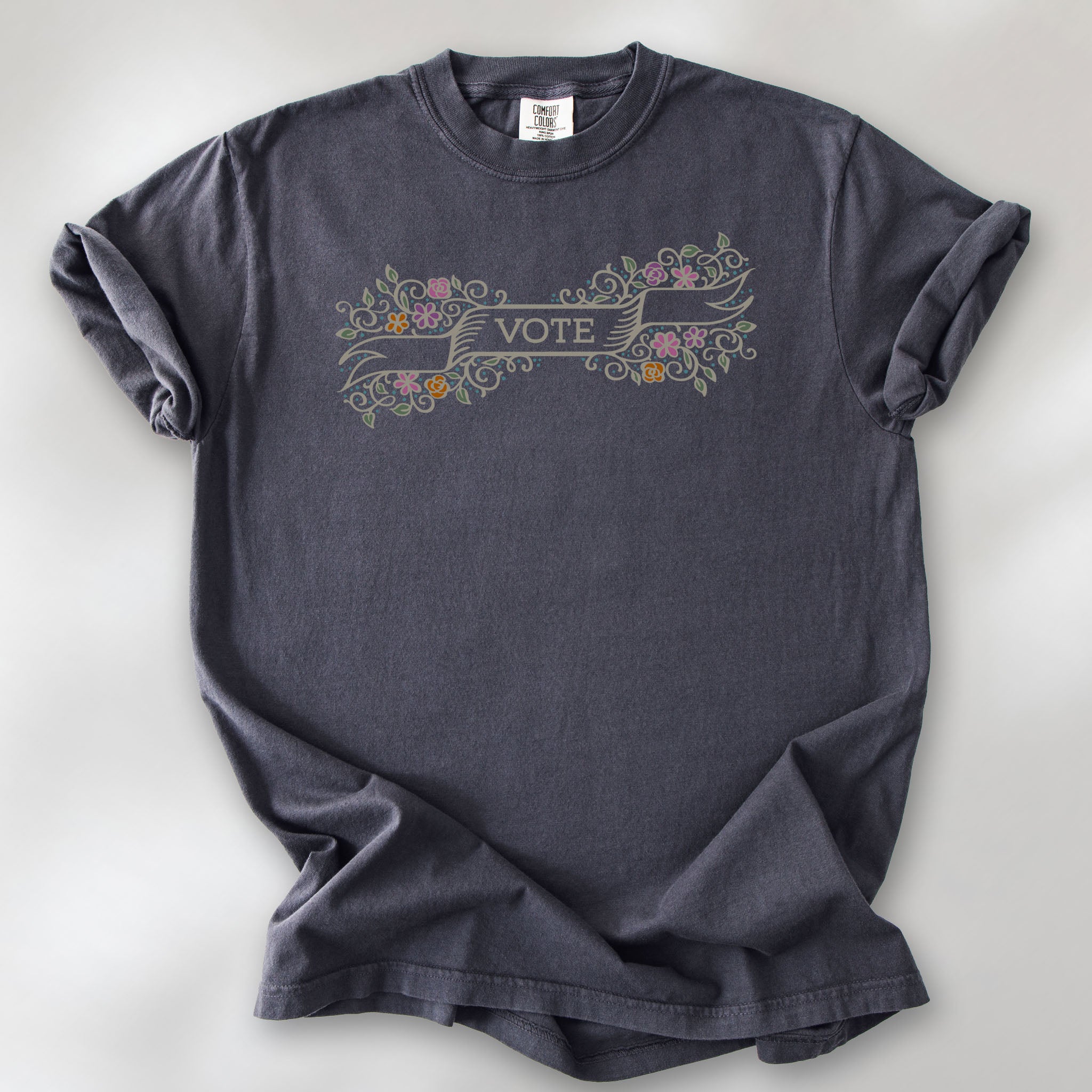 Graphite t-shirt with vintage style floral illustration and a banner reading “vote” in the center.