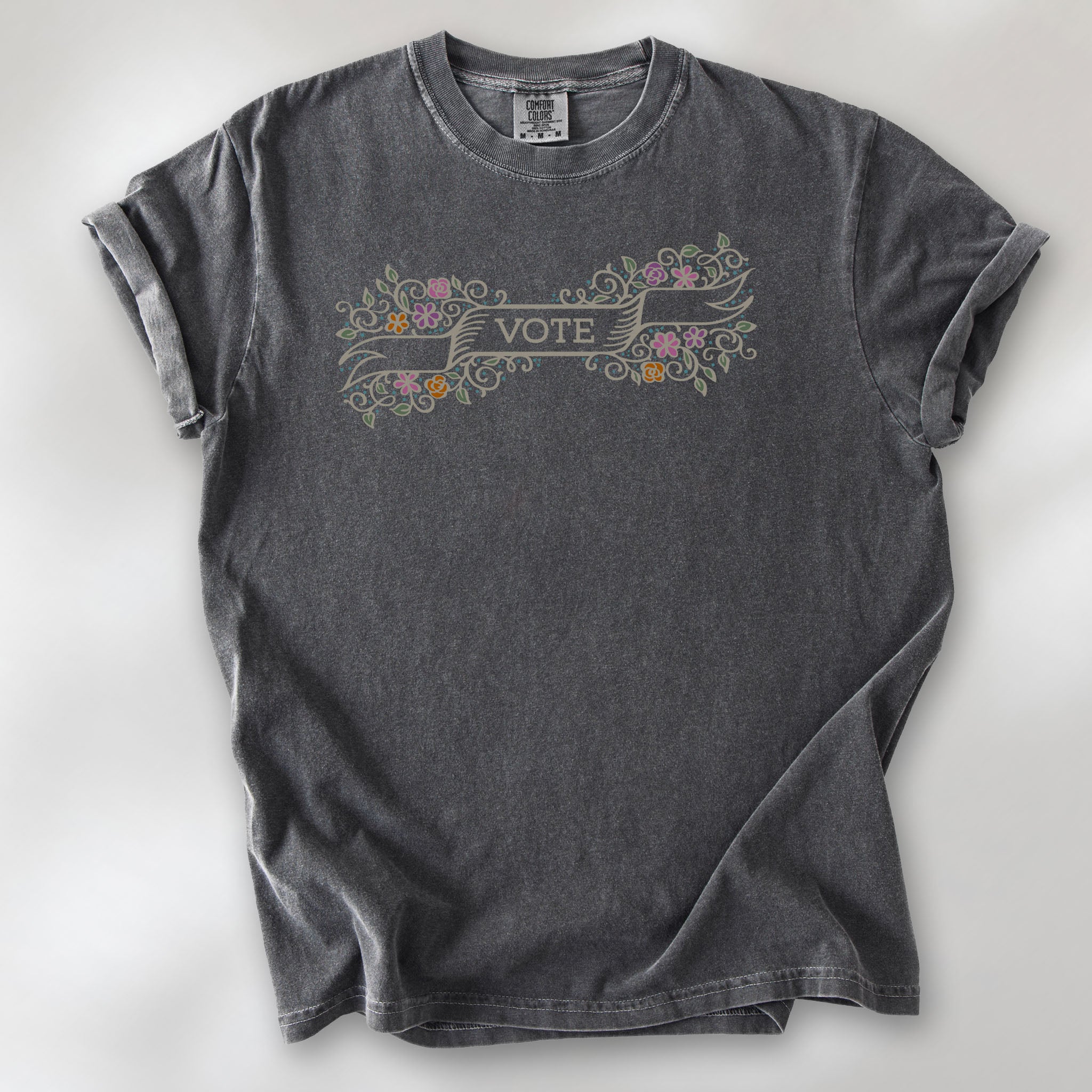 Pepper t-shirt with vintage style floral illustration and a banner reading “vote” in the center.