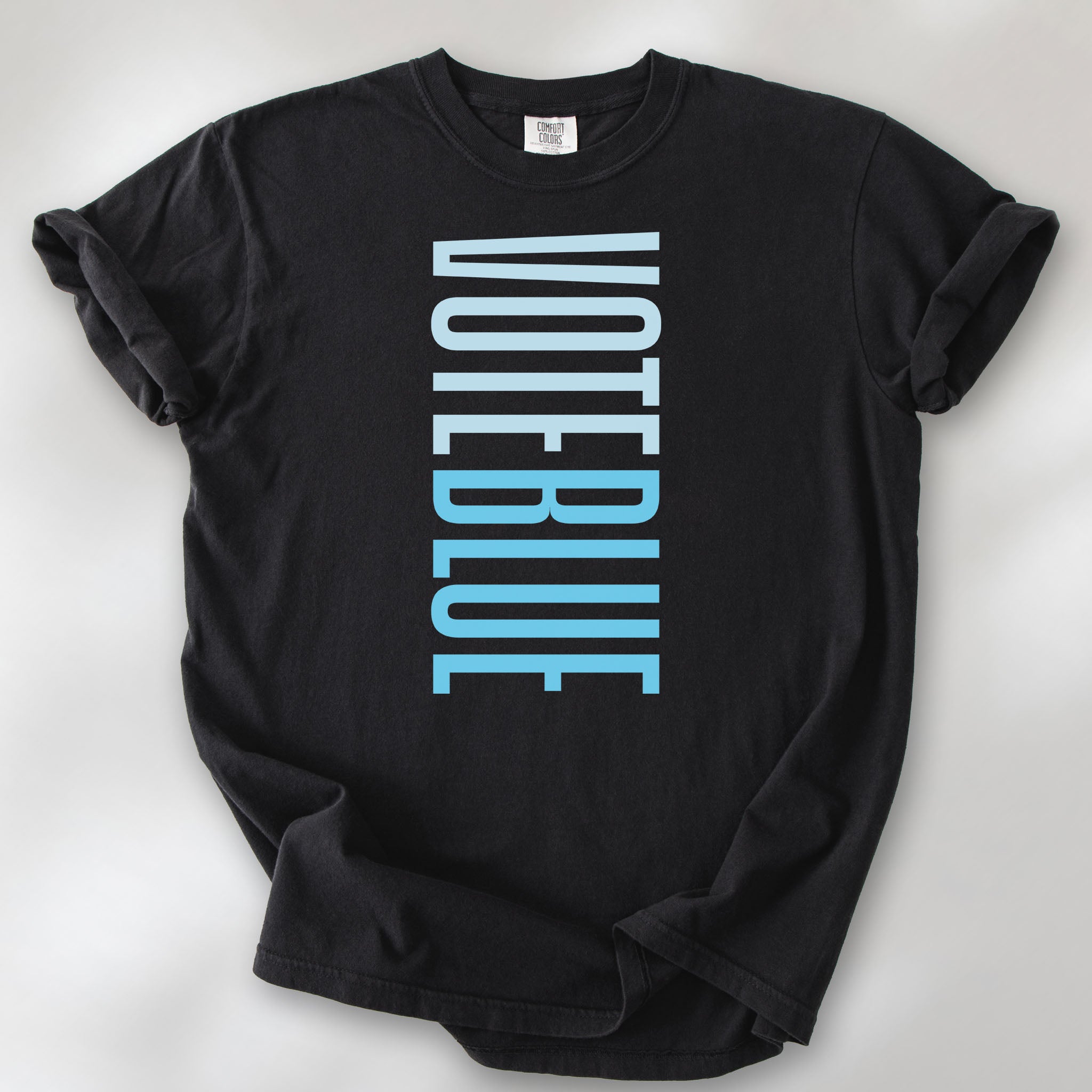 Black t-shirt featuring the words "VOTE BLUE" stacked vertically in bold minimalist blue typography.