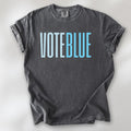 Pepper t-shirt featuring the words "VOTE BLUE" in bold horizontal blue geometric typography with a clean minimalist design.