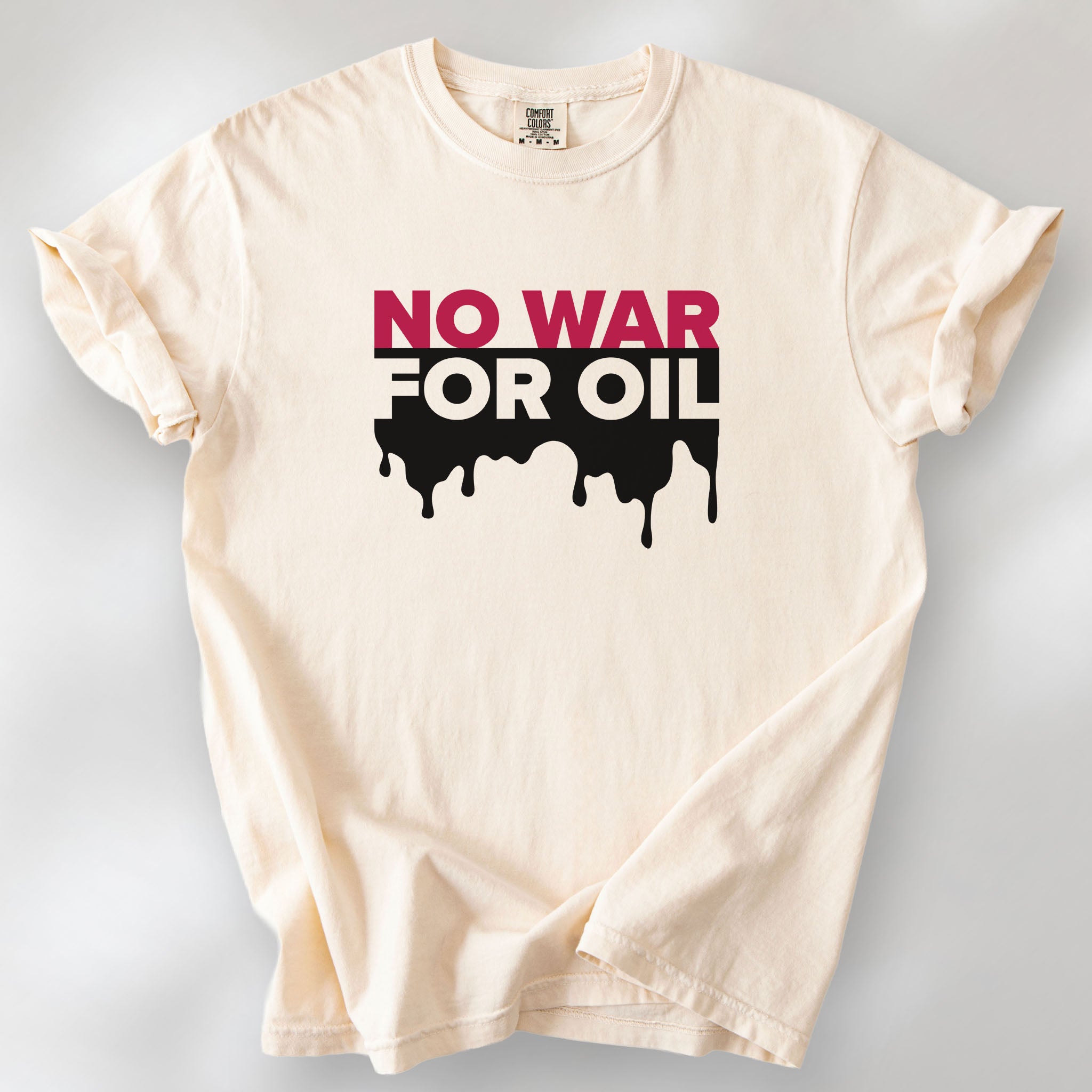 Ivory protest t-shirt with bold text reading “No War for Oil” and dripping oil graphic, anti-war political shirt.