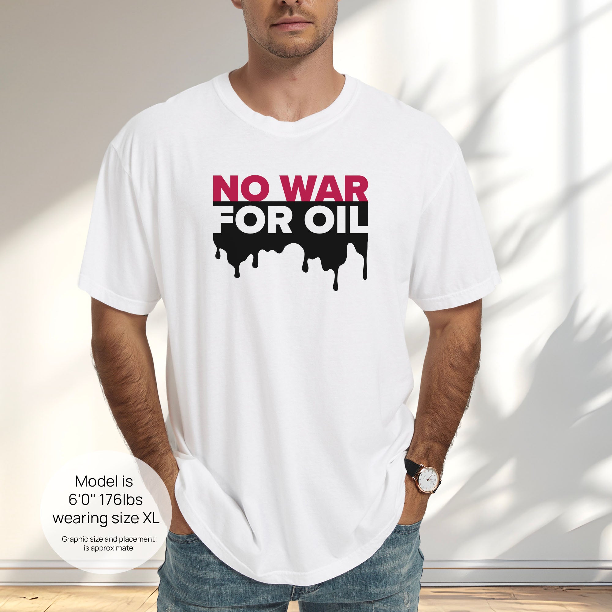 Male model wearing white protest t-shirt with bold text reading “No War for Oil” and dripping oil graphic, anti-war political shirt. Includes size and fit information for the model who is 6 feet 0 inches, 176 pounds, and wearing a size XL shirt.
