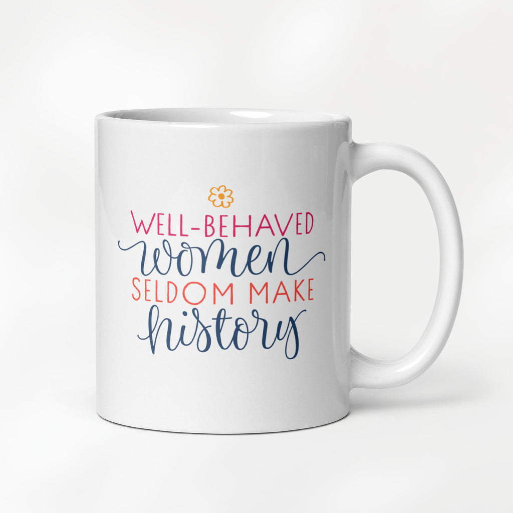 11 ounce ceramic mug with graphic that reads "well-behaved women seldom make history".