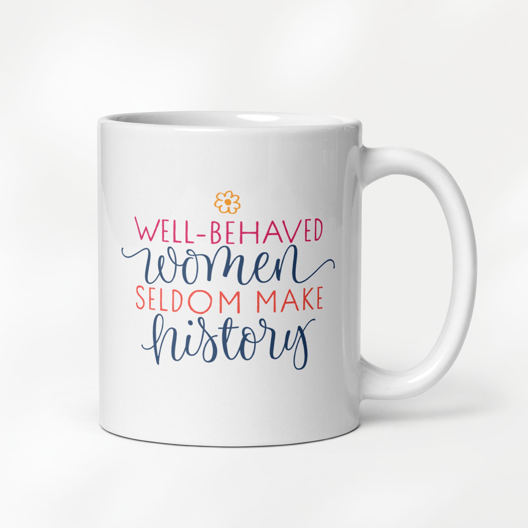 11 ounce ceramic mug with graphic that reads "well-behaved women seldom make history".