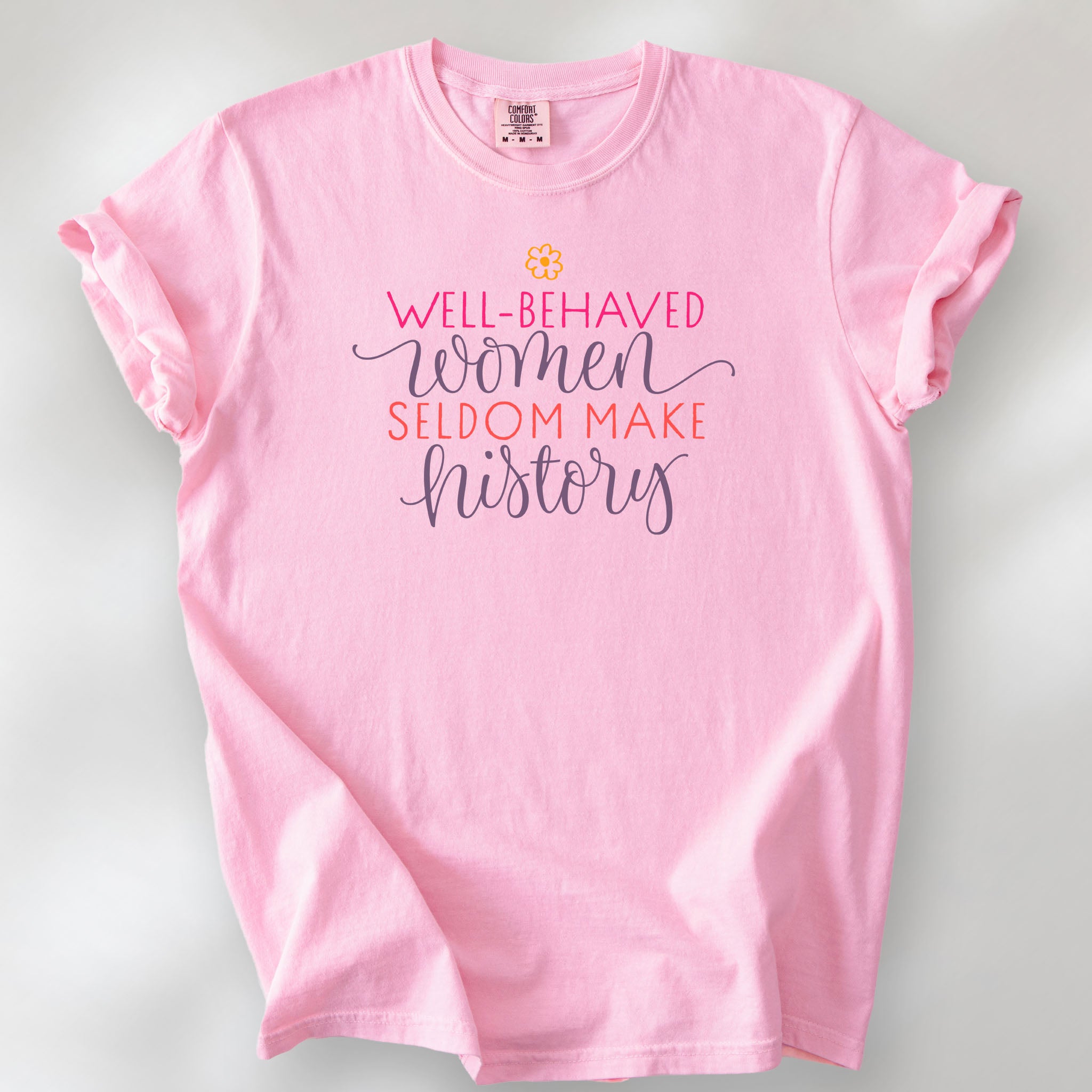 Blossom t-shirt with graphic styled text that reads "well-behaved women seldom make history."
