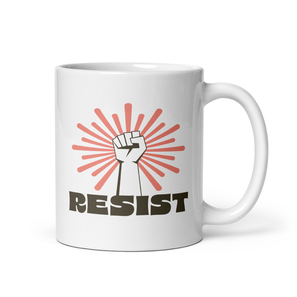 11 ounce coffee mug with a raised fist graphic in front of a coral burst, and bold retro-styled text that says "resist."