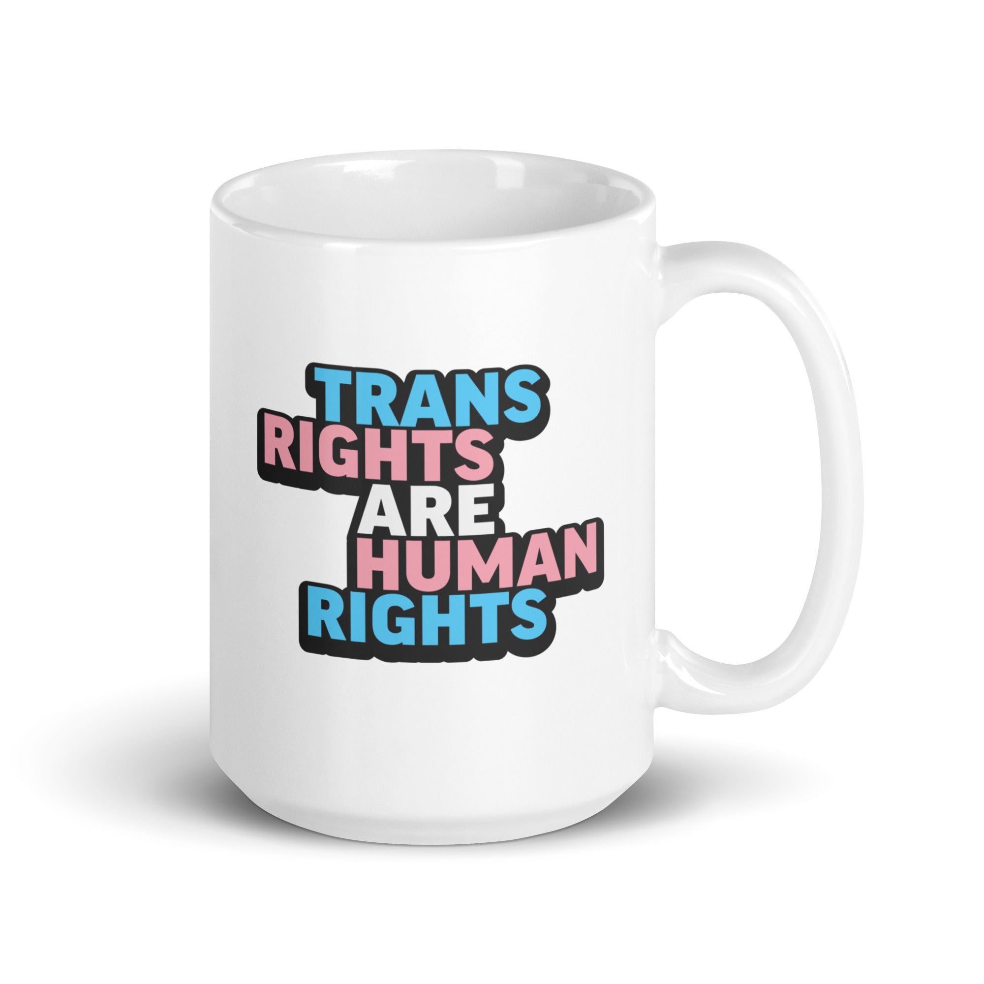 15 ounce white ceramic mug with bold text “Trans Rights Are Human Rights” in blue, pink, and black colors representing the transgender pride flag.