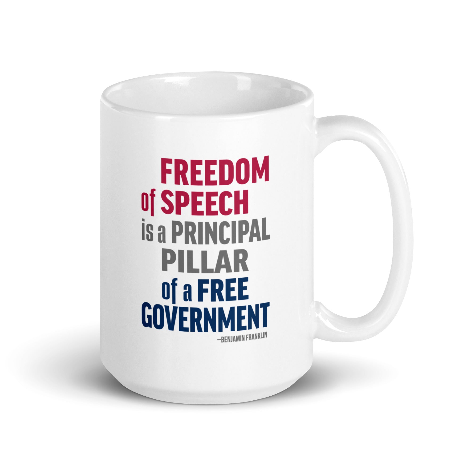 15 ounce white ceramic mug with bold patriotic red, blue, and grey text that reads "Freedom of speech is a principal pillar of a free government. – Ben Franklin."