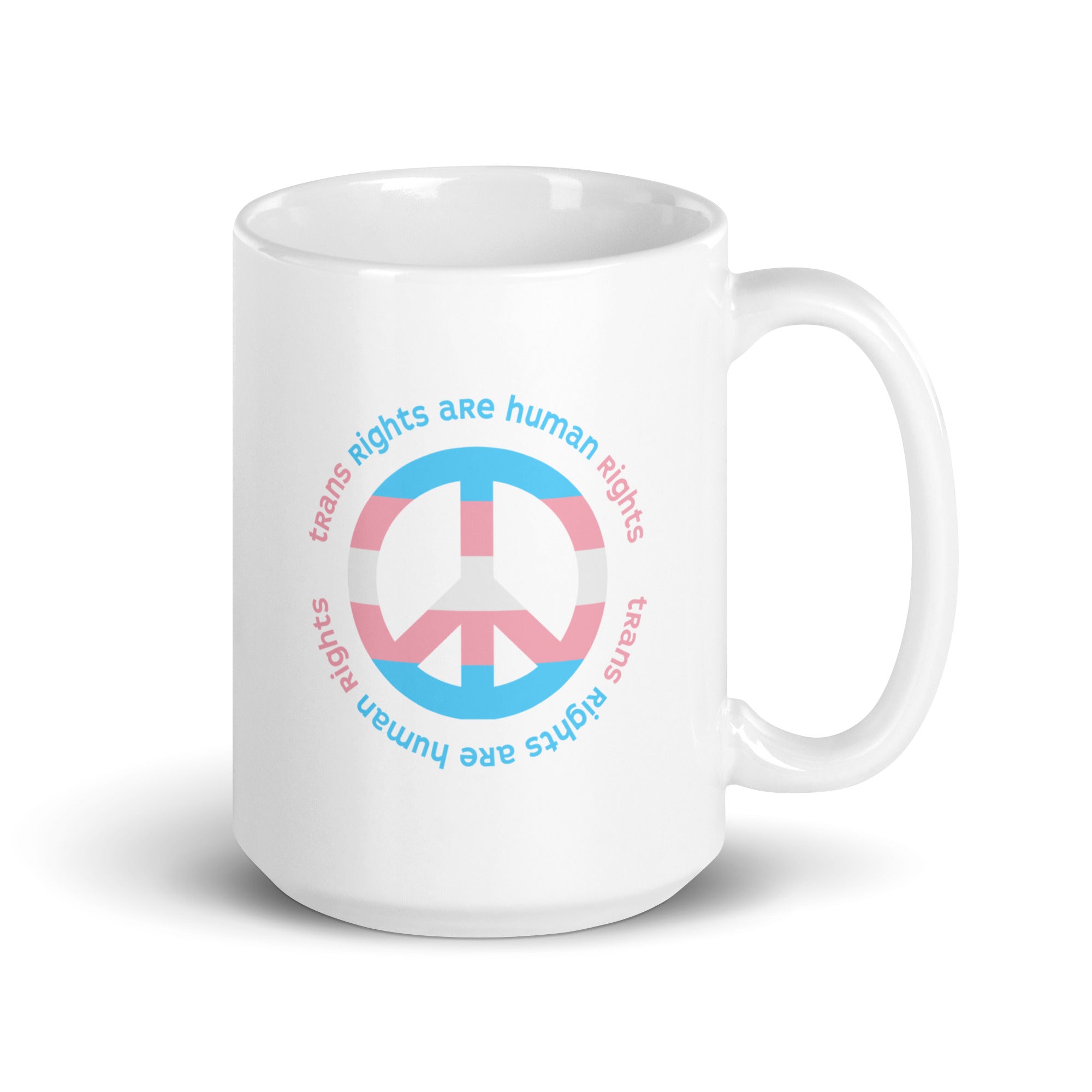 15 ounce coffee mug with a peace sign in transgender flag colors and the text “Trans Rights Are Human Rights” in a circular design around the peace sign.