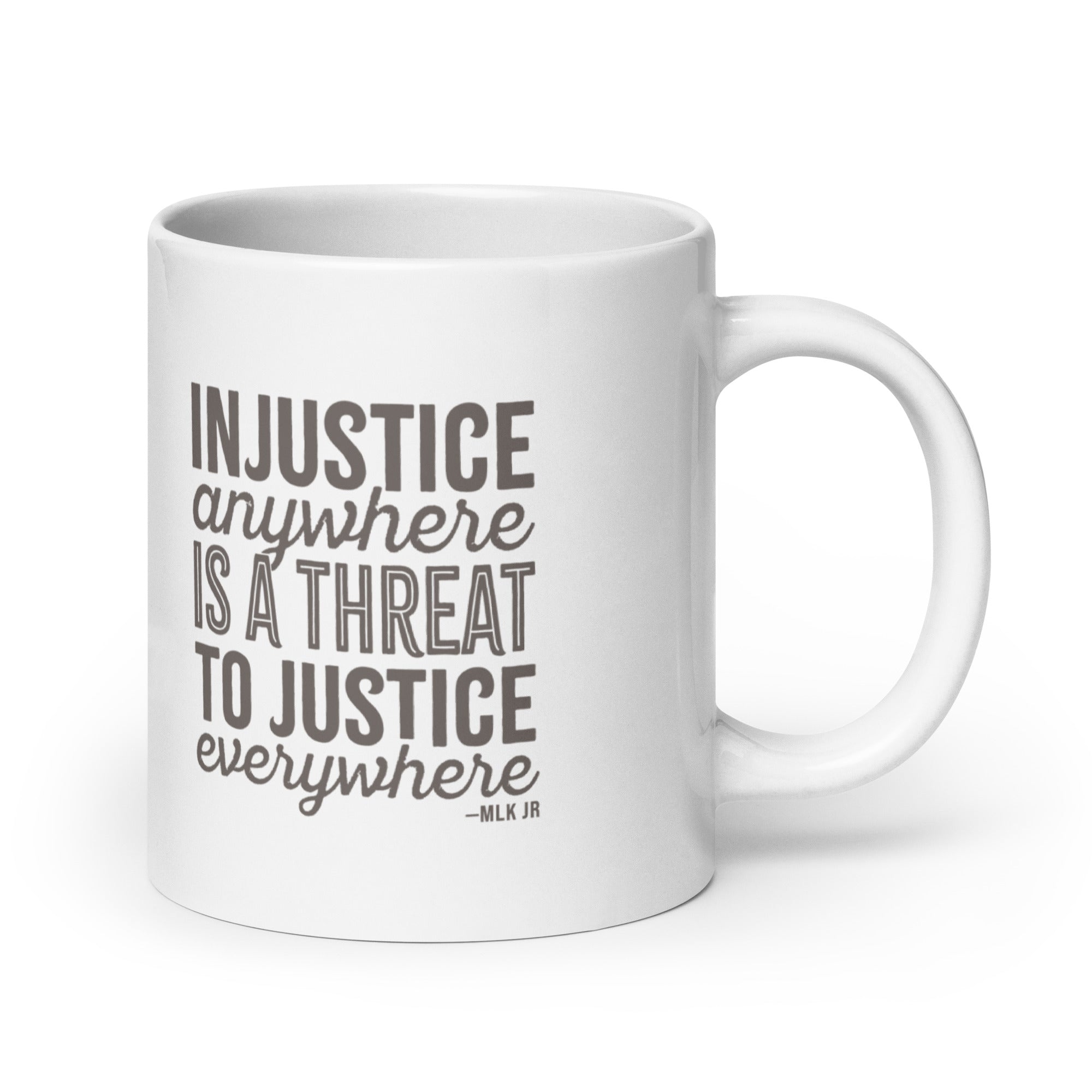 20 ounce white ceramic mug with bold text graphic reading “injustice anywhere is a threat to justice everywhere,” a quote from MLK Junior from Letters from Birmingham Jail.