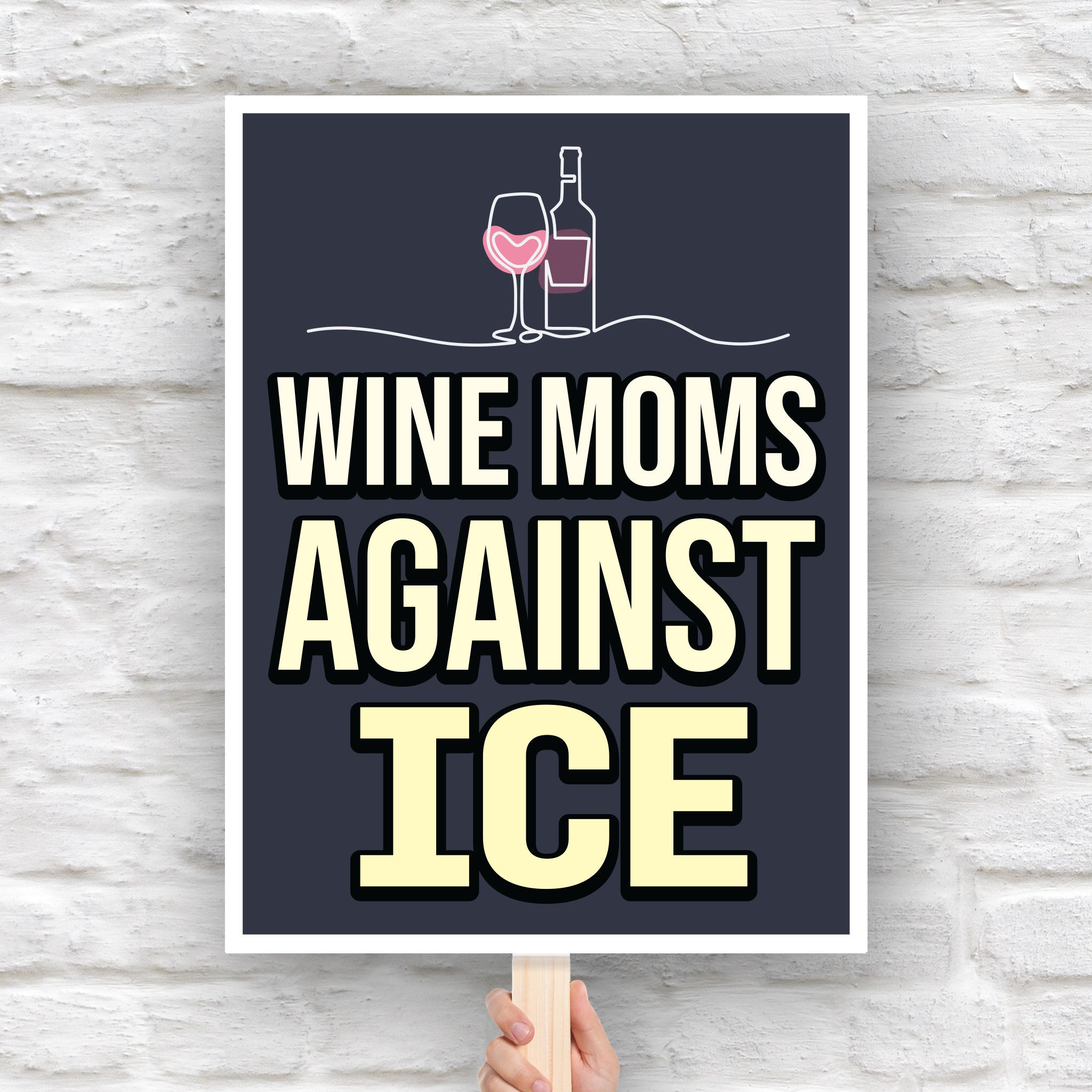 Protest sign reading “Wine Moms Against ICE” with a wine glass and bottle illustration, mocking Fox News claims about wine moms using Antifa tactics against ICE.
